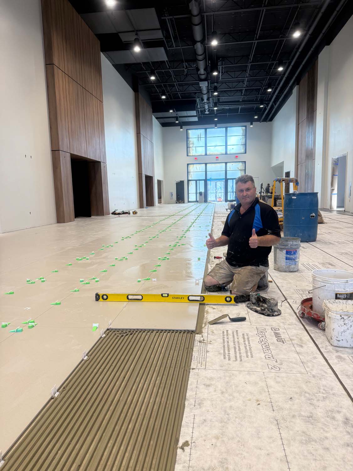 Konstantin — owner of Perfect Touch Tile & Stone — at work on a commercial tile installation project in Jacksonville FL